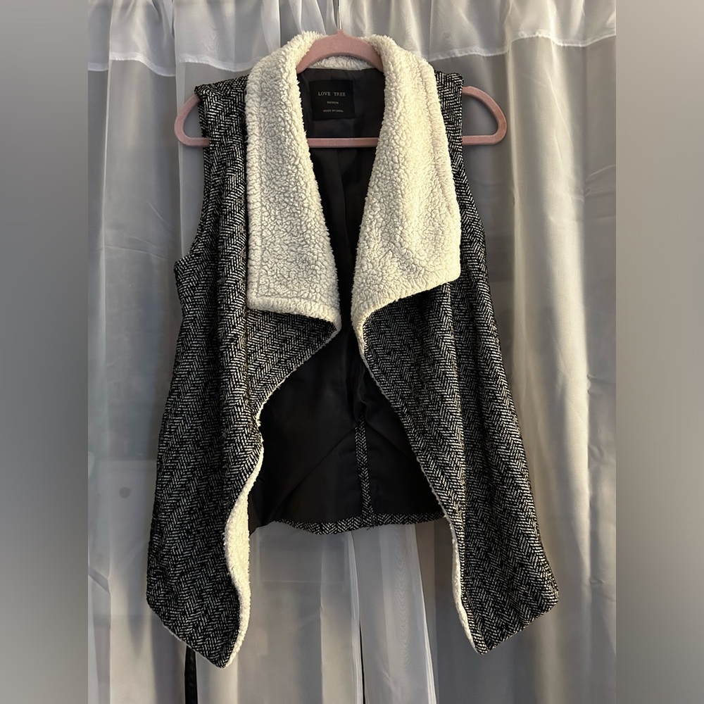 Knit, fleece collared, tie vest.